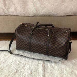 BROWN CHECKERED DUFFLE BAG